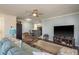Open-concept living space with a ceiling fan, comfortable seating, and a view into the kitchen at 720 Lyndhurst St # 1121, Dunedin, FL 34698