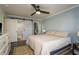 Large main bedroom featuring a barn door to the closet and an attached bathroom at 720 Lyndhurst St # 1121, Dunedin, FL 34698