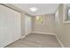 Bedroom features modern flooring, neutral walls, a window, and closet with bi-fold doors at 7323 Andre Dr, Zephyrhills, FL 33541