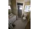 Bathroom featuring tiled floors, a shower, toilet, and vanity at 7735 Gaston Dr, Port Richey, FL 34668