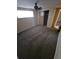 Bedroom featuring neutral-toned walls, carpeted floor, a ceiling fan, and a window at 7735 Gaston Dr, Port Richey, FL 34668