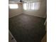 Bright bedroom with carpet floors and windows, perfect for relaxation at 7735 Gaston Dr, Port Richey, FL 34668