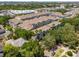 Aerial view of condo complex showing mature landscaping and ample parking at 800 S Dakota Ave # 221, Tampa, FL 33606