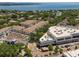 The aerial view showcases apartments and commercial buildings near the water in a vibrant neighborhood at 800 S Dakota Ave # 221, Tampa, FL 33606