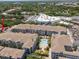 Aerial view of apartment complex featuring central pool and courtyard landscaping at 800 S Dakota Ave # 221, Tampa, FL 33606