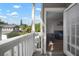 Exterior balcony leading to living area with furniture at 800 S Dakota Ave # 221, Tampa, FL 33606