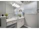 Well-lit bathroom with a large mirror, sleek vanity, and a modern design at 800 S Dakota Ave # 221, Tampa, FL 33606