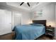 Comfortable bedroom with a tray ceiling, ceiling fan and a closet for ample storage at 800 S Dakota Ave # 221, Tampa, FL 33606