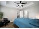 Cozy bedroom featuring a ceiling fan, ensuite bathroom, and closet space at 800 S Dakota Ave # 221, Tampa, FL 33606