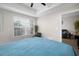 Bright bedroom featuring a large window, and a view to the living room at 800 S Dakota Ave # 221, Tampa, FL 33606