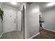 Welcoming entryway showcases tile flooring, a coat closet, and access to the kitchen with stainless steel appliances at 800 S Dakota Ave # 221, Tampa, FL 33606