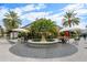 Outdoor community fountain with cafe-style seating and palm trees at 800 S Dakota Ave # 221, Tampa, FL 33606