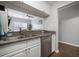 Kitchen with stainless steel appliances, granite countertops and an open view to the living room at 800 S Dakota Ave # 221, Tampa, FL 33606