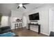 Stylish living space with hardwood floors, a ceiling fan and a modern kitchen view with bar seating at 800 S Dakota Ave # 221, Tampa, FL 33606