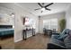 Cozy living room with hardwood floors, a ceiling fan, a dining table and a view to the bedroom at 800 S Dakota Ave # 221, Tampa, FL 33606