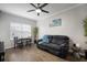 Bright living area with hardwood floors, a ceiling fan, dining table, modern decor and comfortable seating at 800 S Dakota Ave # 221, Tampa, FL 33606