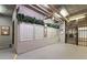Indoor mailboxes with leafy decoration, security gate, and cork board for resident communications at 800 S Dakota Ave # 221, Tampa, FL 33606