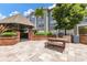 Outdoor patio area featuring an outdoor grill, seating, and landscaping for entertaining at 800 S Dakota Ave # 221, Tampa, FL 33606
