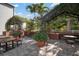 Outdoor patio area featuring covered seating areas and lush landscaping at 800 S Dakota Ave # 221, Tampa, FL 33606
