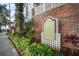 Community signage for Hyde Park Walk surrounded by meticulous landscaping at 800 S Dakota Ave # 221, Tampa, FL 33606