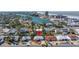 Coastal home with stunning views of the channel and beach, surrounded by lush tropical landscaping at 88 45Th Ave, St Pete Beach, FL 33706
