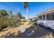 Backyard featuring a gravel groundcover, stepping stones, and a lush garden area at 88 45Th Ave, St Pete Beach, FL 33706