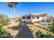 Backyard featuring low profile plants, palm trees, and a gravel groundcover at 88 45Th Ave, St Pete Beach, FL 33706