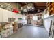 Spacious basement with storage cabinets, a water heater and a utility sink at 88 45Th Ave, St Pete Beach, FL 33706