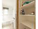 A view into the bathroom, next to an open storage closet stocked with essentials at 88 45Th Ave, St Pete Beach, FL 33706
