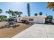 Inviting single-story home with a well-kept lawn, mature landscaping, and an attached garage at 88 45Th Ave, St Pete Beach, FL 33706