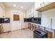 Bright kitchen with white cabinetry and a black backsplash, ready to make your own at 88 45Th Ave, St Pete Beach, FL 33706