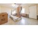 Spacious living room featuring a bright interior and natural light coming through the large windows at 88 45Th Ave, St Pete Beach, FL 33706