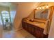 Cozy bathroom with granite vanity, tiled floor, and bright natural light at 8910 Eagle Watch Dr, Riverview, FL 33578