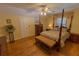 Bedroom with hardwood floors, bed, and natural light at 8910 Eagle Watch Dr, Riverview, FL 33578
