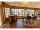 Dining area featuring water views from the windows, and adjacent living space for entertaining at 8910 Eagle Watch Dr, Riverview, FL 33578