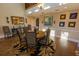 Elegant dining room featuring a stylish rug, wood floors, and decorative wall art at 8910 Eagle Watch Dr, Riverview, FL 33578