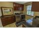 Laundry room features granite countertops, dark cabinetry, and stainless steel appliances at 8910 Eagle Watch Dr, Riverview, FL 33578