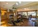 Open living area with fireplace, hardwood floors, skylights, and a view of the lake at 8910 Eagle Watch Dr, Riverview, FL 33578