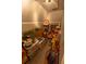 Overstuffed storage room with boxes and decor, under a sloped ceiling and neutral wall color at 8910 Eagle Watch Dr, Riverview, FL 33578
