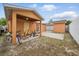 Backyard with covered patio area, providing a functional and private outdoor space at 9122 Suffield Ct, Tampa, FL 33615