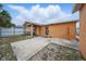 Backyard featuring a concrete patio and partially fenced yard, offering privacy and space at 9122 Suffield Ct, Tampa, FL 33615