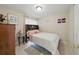 Comfortable bedroom with neutral tones, carpet flooring, and ample natural light at 9122 Suffield Ct, Tampa, FL 33615
