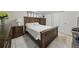 Bedroom with coordinating furniture, tile floors, and neutral decor for a serene atmosphere at 9122 Suffield Ct, Tampa, FL 33615