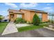 Well-kept home exterior showcasing meticulous landscaping, a spacious driveway, and solar panels at 9122 Suffield Ct, Tampa, FL 33615