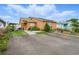 Beautiful exterior view of a well-maintained home featuring a spacious driveway and landscaping at 9122 Suffield Ct, Tampa, FL 33615