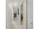 Hallway showcasing tile flooring leading to bedrooms and living spaces at 9122 Suffield Ct, Tampa, FL 33615