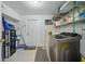 Functional laundry room with modern washer and dryer and ample storage space at 9122 Suffield Ct, Tampa, FL 33615