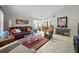 Bright living room with vaulted ceilings and tile flooring, seamlessly connecting to the kitchen at 9122 Suffield Ct, Tampa, FL 33615