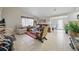 Inviting living room featuring tile floors and a comfortable seating arrangement at 9122 Suffield Ct, Tampa, FL 33615