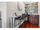 Stylish bar area with custom shelving, seating, and an elegant marble countertop at 920 N Shore Ne Dr, St Petersburg, FL 33701